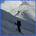 Skier standing just above Ladies Pass looking NW on the Chiwaukums Traverse.