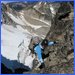 Toping out on the gully leading to the North Ridge, glacier traverse visible below.