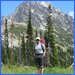 Happy climber with West Ridge of Mt. Stuart behind after good climb on Upper North Ridge.